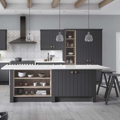 Pembrook Grooved kitchen cabinets in grey. Tall cupboards and full height open shelving. Kitchen island with cupboards and open shelving