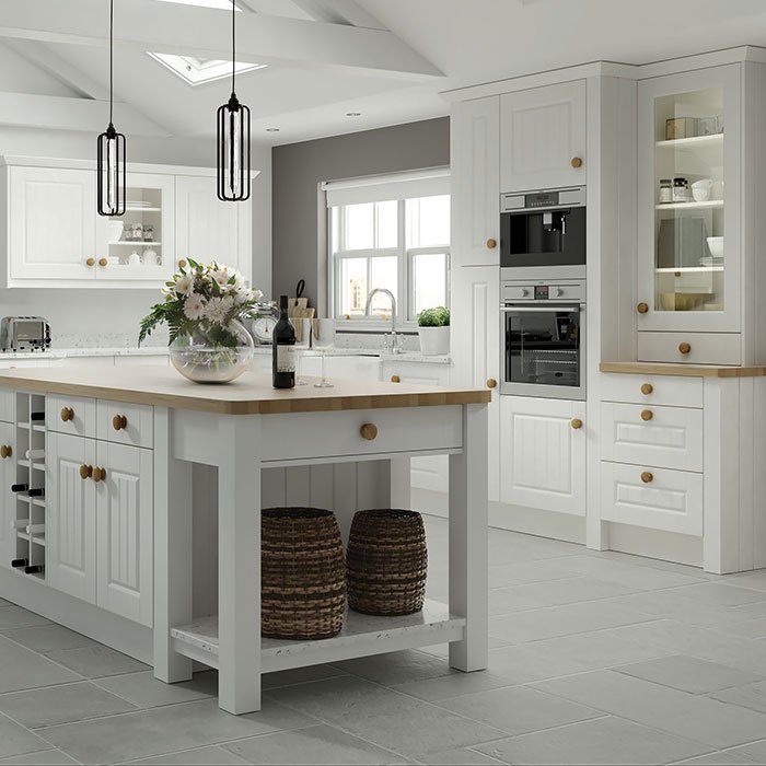 Amalfi Grooved raised panel kitchen in Woodgrain White. Kitchen island with cupboards, integrated wine rack and open shelving