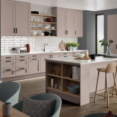 Cashmere beige shaker kitchen with open shelving, tall 4 panel shaker doors and a kitchen island with cupboards, open shelving and seating