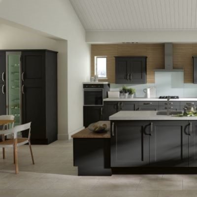 Dark grey shaker kitchen with tall units and full height wine cooler, tall base units and a split level kitchen island with built in seating and cupboards
