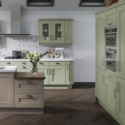 Greenwich solid timber shaker kitchen. Base and wall cupboards in sage and a kitchen island in stone grey