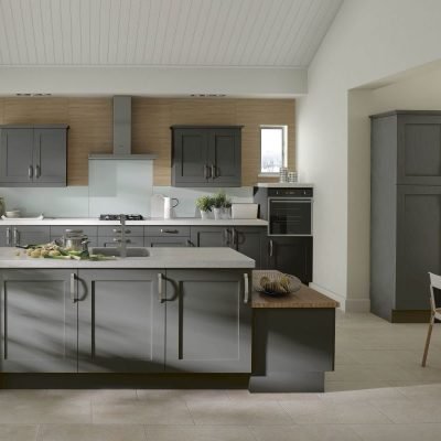 Lanark plain shaker kitchen cabinets in dust grey. Tall wall units and full length wine cooler and kitchen island with cupboards and bench seat