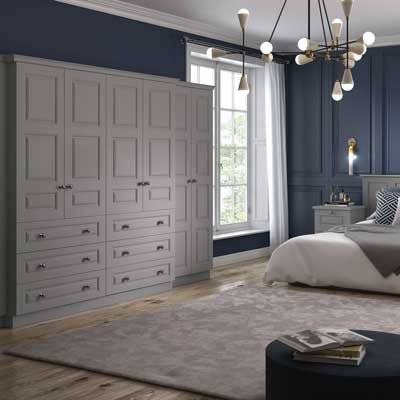 Lincoln Fitted raised panel wardrobes with external drawers, matching bedside tables and headboard in Dust Grey
