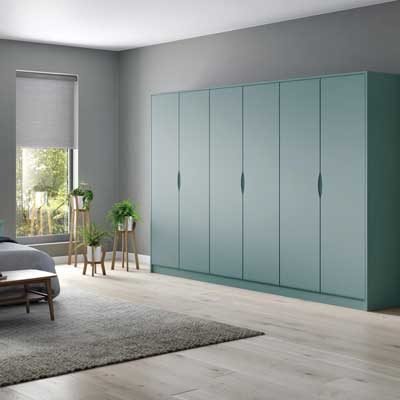 Loretto fitted J pull wardrobes and matching bedside tables in Fjord (Blue-Green)