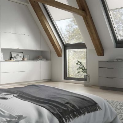 Rana/Neptune angled fitted j-pull wardrobes and matching fitted drawers in Light Grey Wood grain