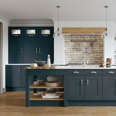 Rathlin mock in-frame kitchen in indigo. Tall units with glass inserts and a kitchen island with cupboards, drawers and open shelving